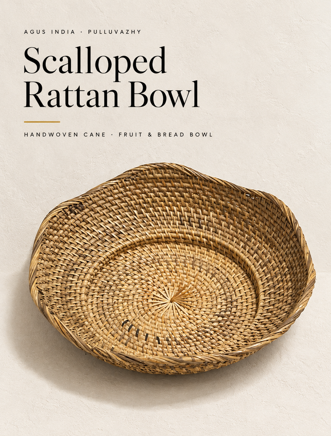 A shallow round bowl in undyed rattan, woven as one spiral from the centre out.